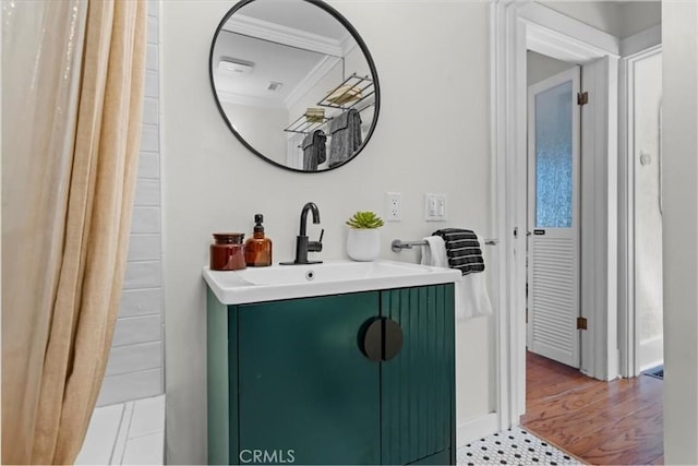 bathroom featuring vanity and ornamental molding