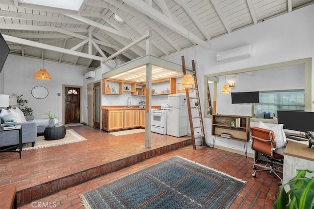 office featuring a wall unit AC, high vaulted ceiling, brick floor, and a sink