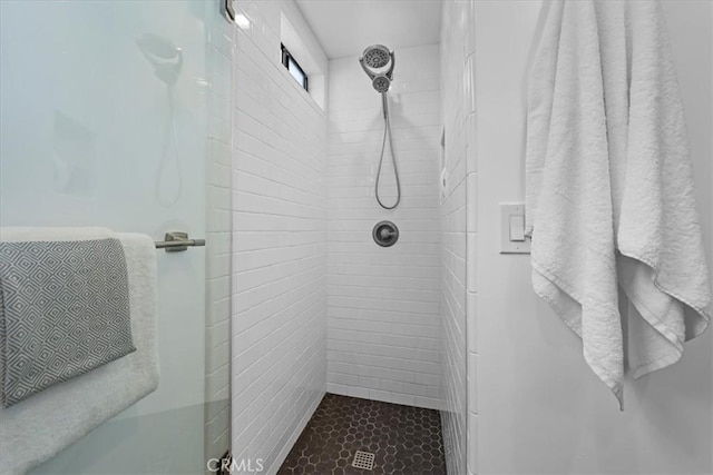 bathroom with a shower stall