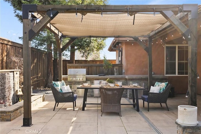 view of patio with a grill and a fenced backyard