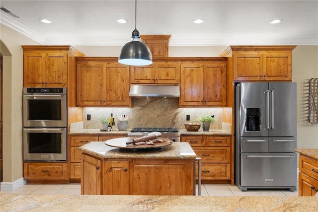 kitchen featuring light tile patterned floors, visible vents, stainless steel appliances, under cabinet range hood, and crown molding