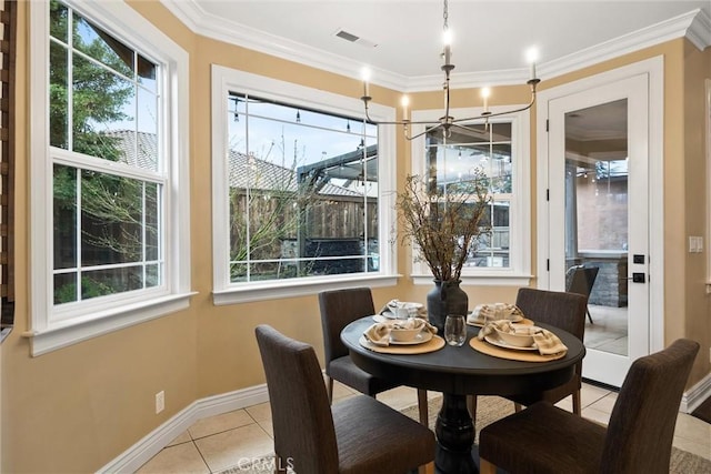 dining space with light tile patterned floors, plenty of natural light, and ornamental molding