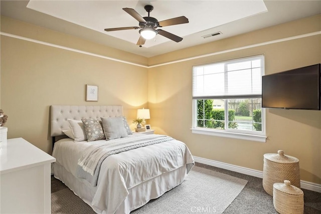 bedroom featuring visible vents, a ceiling fan, and baseboards