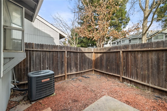 view of yard featuring cooling unit and a fenced backyard