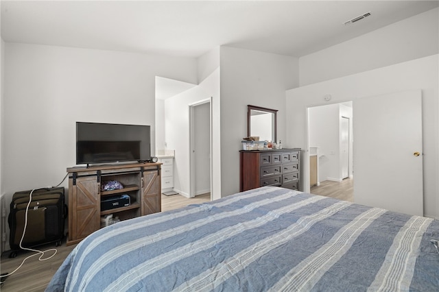 bedroom featuring visible vents and light wood-type flooring