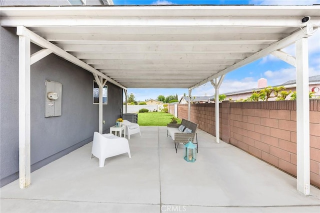 view of patio featuring fence