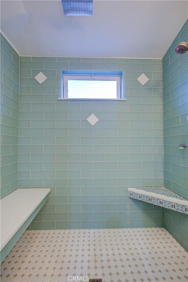 bathroom with tiled shower