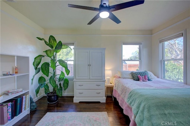 bedroom featuring dark wood-style floors and ceiling fan