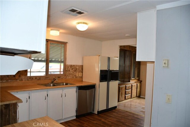 kitchen with visible vents, dishwasher, white fridge with ice dispenser, white cabinets, and a sink