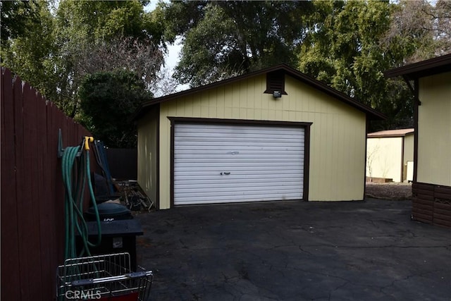 detached garage with fence