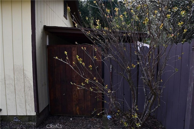 view of gate featuring fence