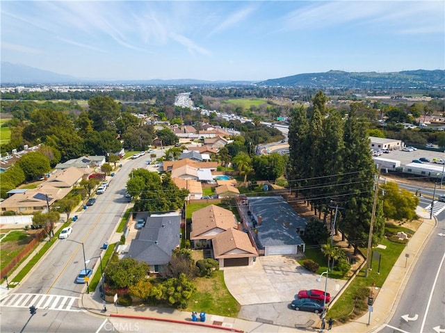 drone / aerial view with a residential view and a mountain view