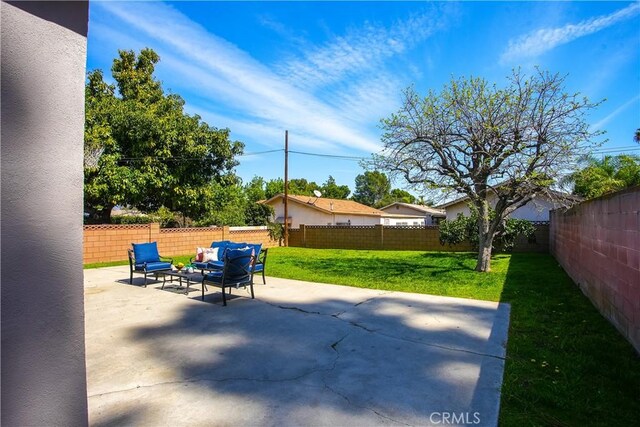 view of patio / terrace featuring an outdoor living space and a fenced backyard