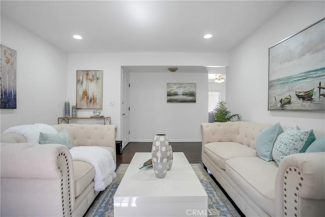 living area featuring dark wood finished floors, recessed lighting, and baseboards