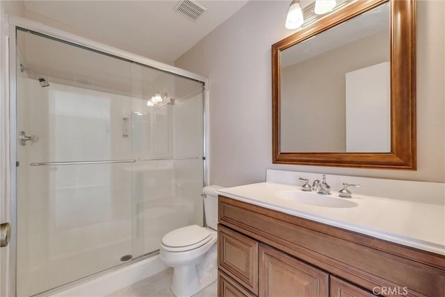 full bathroom featuring visible vents, toilet, a stall shower, and vanity