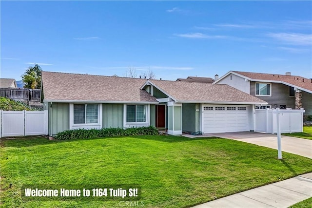 view of front facade with a front lawn, an attached garage, fence, and driveway