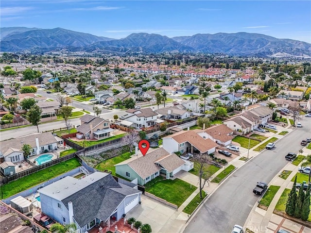 birds eye view of property featuring a mountain view and a residential view