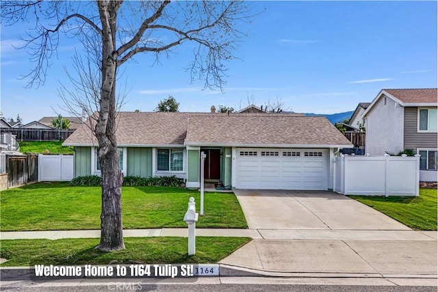 view of front of house with a shingled roof, a front lawn, fence, a garage, and driveway