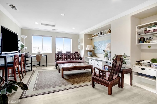 living room with visible vents, recessed lighting, and ornamental molding