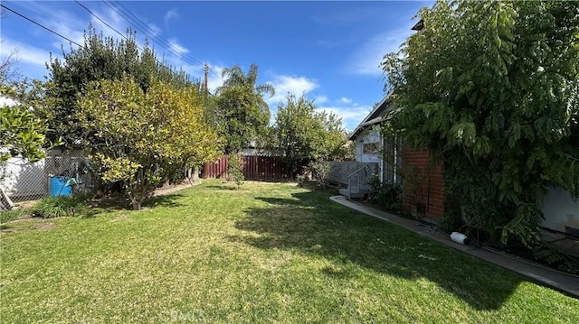 view of yard featuring a fenced backyard