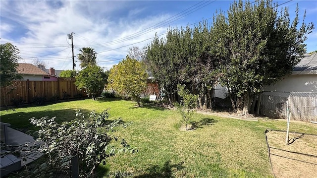 view of yard with a fenced backyard