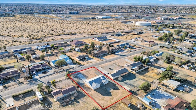 birds eye view of property featuring view of desert