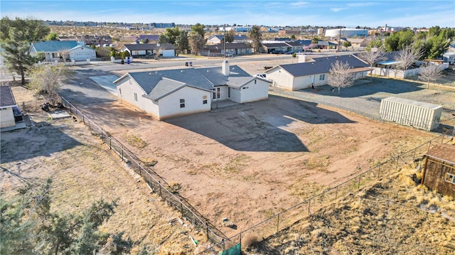 birds eye view of property with a residential view