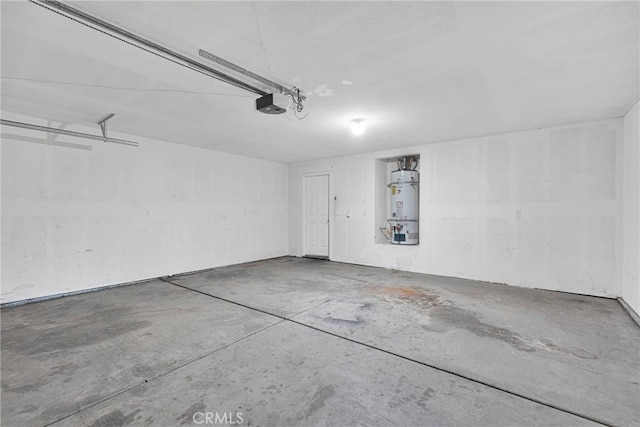 garage with strapped water heater and a garage door opener