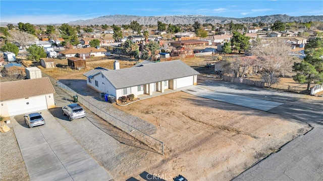 drone / aerial view featuring a mountain view and a residential view