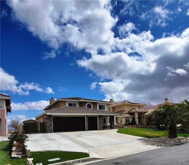 view of front facade featuring a gate, stone siding, concrete driveway, a garage, and a chimney