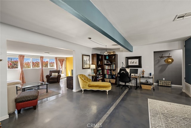 interior space with beamed ceiling, finished concrete flooring, baseboards, and visible vents