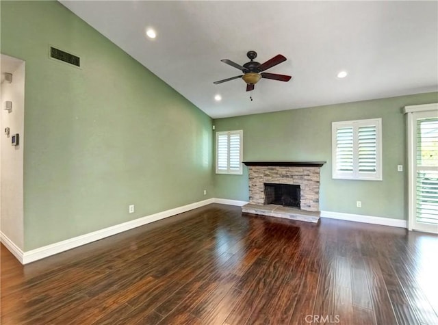 unfurnished living room featuring visible vents, baseboards, dark wood-type flooring, and a fireplace