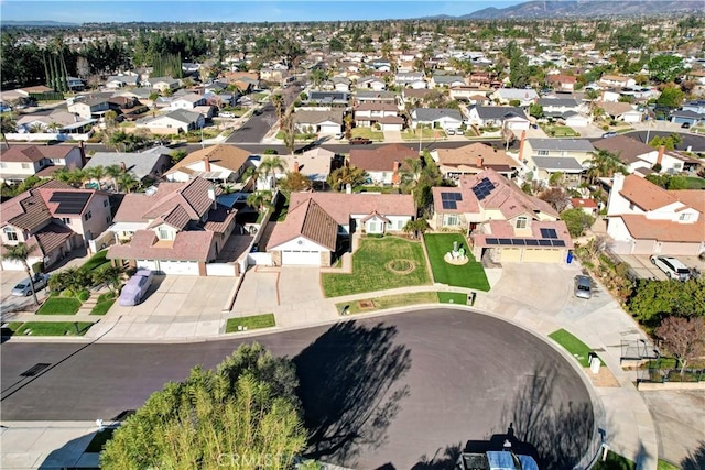 birds eye view of property with a mountain view and a residential view