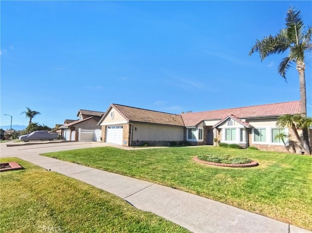 single story home featuring stone siding, stucco siding, and a front yard