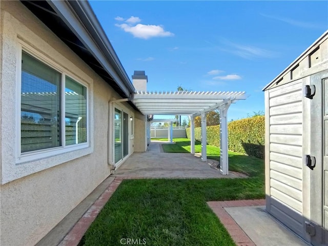 view of yard with a pergola, a patio, and fence