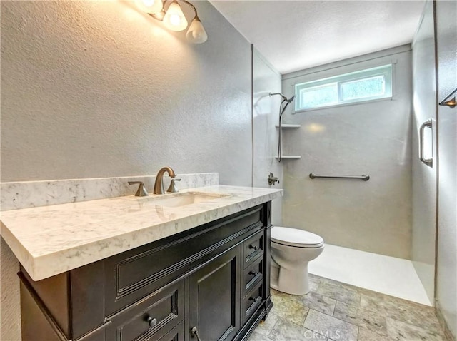 full bath with a shower, stone finish flooring, toilet, and vanity