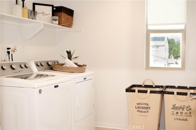 laundry area with washer and clothes dryer and laundry area