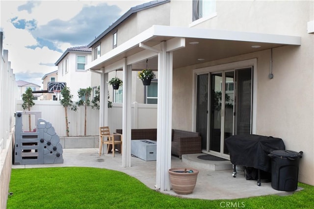 view of patio with grilling area and fence