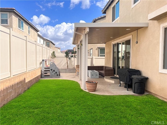 view of yard featuring a patio and a fenced backyard