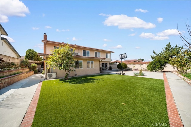 exterior space featuring a front lawn, fence, ac unit, stucco siding, and a chimney