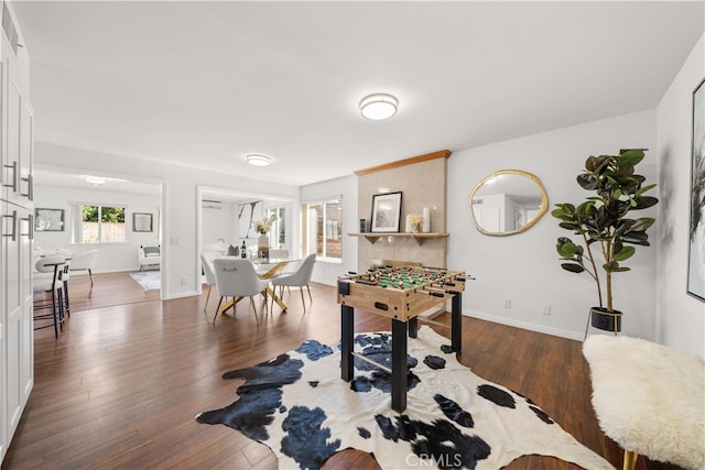 playroom with baseboards and wood finished floors