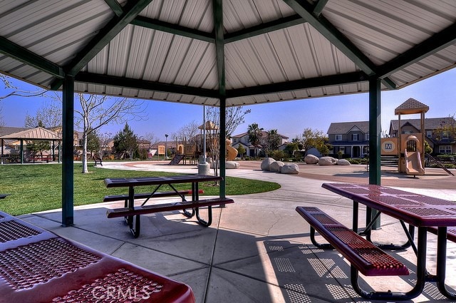 view of property's community featuring a gazebo, playground community, a residential view, and a yard