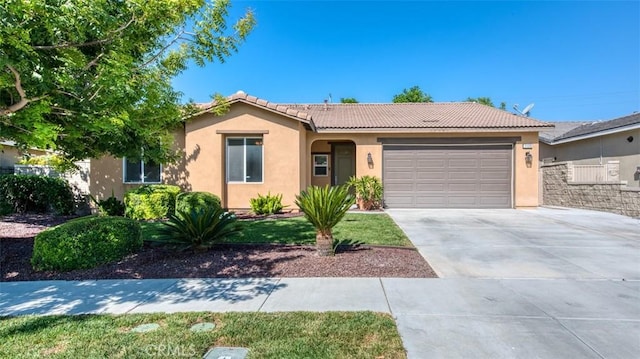 ranch-style home featuring stucco siding, a garage, driveway, and a tile roof