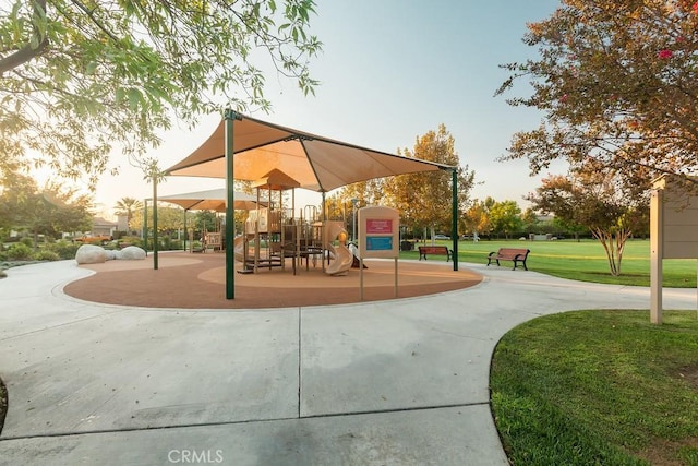 community playground featuring a lawn