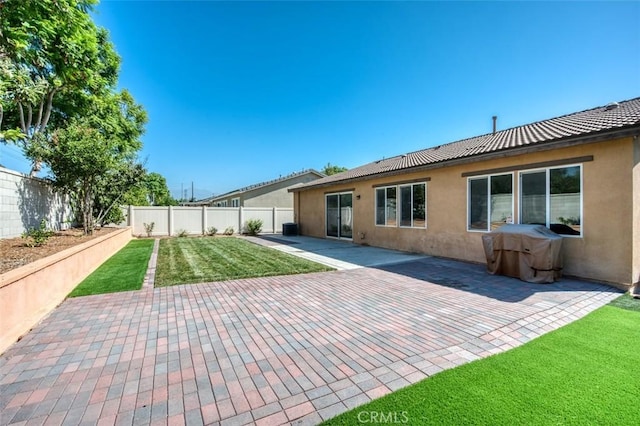 back of property featuring a patio area, a fenced backyard, and stucco siding