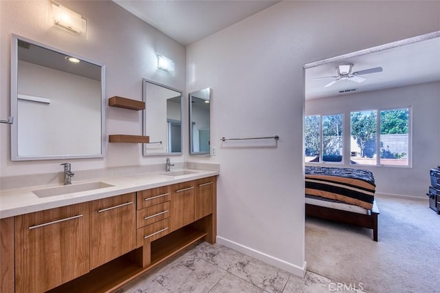 full bathroom featuring ensuite bath, baseboards, and a sink