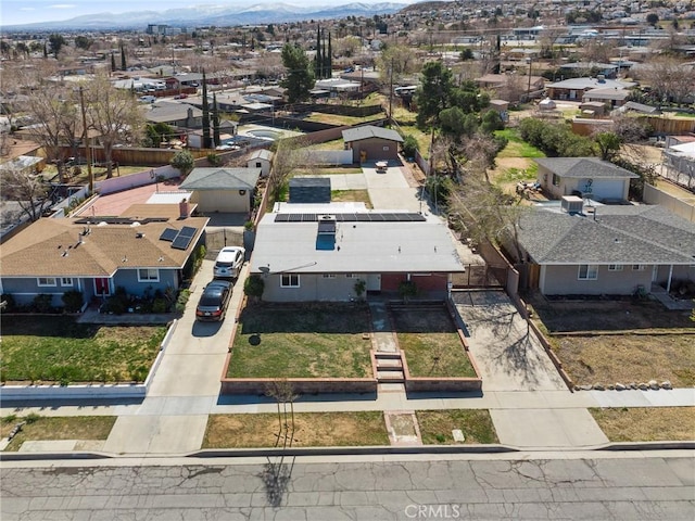 birds eye view of property with a mountain view and a residential view