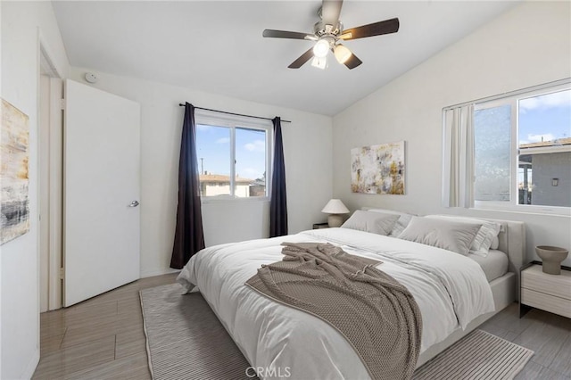 bedroom with ceiling fan and vaulted ceiling