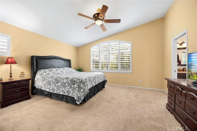 bedroom with baseboards, light colored carpet, ceiling fan, and vaulted ceiling