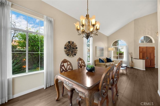 dining space with a wealth of natural light, baseboards, and wood finished floors